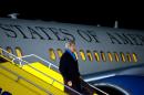 US Secretary of State John Kerry disembarks the airplane upon his arrival in Vienna on November 20, 2014