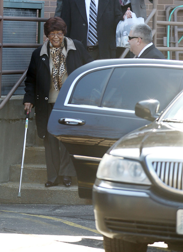 Louise White, left, 81 from Newport R.I., enters a limousine after a press conference where she came forward as the the winner of the $336.4 million Powerball jackpot, Tuesday, March 6, 2012, at the R