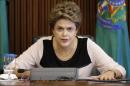 Brazil's President Rousseff reacts during a meeting with jurists defending her against impeachment at the Planalto Palace in Brasilia