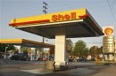 A vehicle stops next to the gas pumps at a Shell gas station with prices at around $4 a gallon in Burbank, California