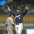 Milwaukee Brewers' Ryan Braun (8) reacts after his pinch hit RBI double during the sixth inning of a baseball game against the Pittsburgh Pirates Monday, Sept. 26, 2011, in Milwaukee. (AP Photo/Jeffrey Phelps)