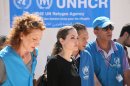 The U.N. refugee agency's special envoy, actress Angelina Jolie, center, arrives to the Zaatari Refugees Camp in Jordan for Syrians who fled the civil war in their country, Tuesday, Sept. 11, 2012. Jolie said Tuesday she heard "horrific" and "heartbreaking" accounts from Syrian refugees in a camp which hosts about 30,000 Syrians displaced by the 18-month conflict that has so far claimed at least 23,000 lives, according to activists. (AP photo/Mohammad Hannon)