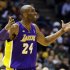 Los Angeles Lakers' Kobe Bryant argues a call against the Milwaukee Bucks during the second half of an NBA basketball game, Thursday, March 28, 2013, in Milwaukee. The Bucks won 113-103.(AP Photo/Jeffrey Phelps)