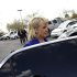Arizona Governor Jan Brewer enters her vehicle after talks with reporters and voting for Republican presidential candidate and former Massachusetts Governor Mitt Romney in