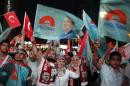 Supporters of Turkey's PM Erdogan celebrate his election victory in front of the party headquarters in Ankara
