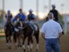 Trainer Todd Pletcher watches horses during a morning workout at Churchill Downs Thursday, May 2, 2013, in Louisville, Ky. (AP Photo/Charlie Riedel)