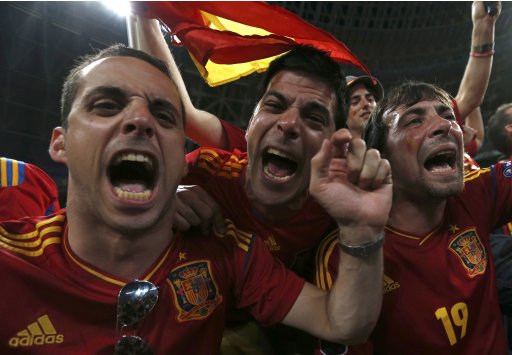 Spain soccer fans cheer as they wait for the start of the Euro 2012 semi-final soccer match between Portugal and Spainat the Donbass Arena in Donetsk
