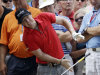 Rory McIlroy, of Northern Ireland, reacts as he loses his club after hitting a tree root on the third hole during the first round of the PGA Championship golf tournament Thursday, Aug. 11, 2011, at the Atlanta Athletic Club in Johns Creek, Ga. (AP Photo/David J. Phillip)
