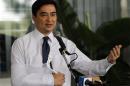 Thailand's opposition leader and former Prime Minister Abhisit Vejjajiva gestures during a news conference in Bangkok