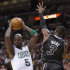 Boston Celtics forward Kevin Garnett (5) comes up with a rebound against Miami Heat guard Dwyane Wade (3) during the first half of an NBA basketball game, Tuesday, April 10, 2012 in Miami. (AP Photo/Wilfredo Lee)