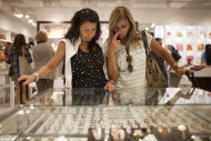 In this March 4, 2012 photo, Beatriz Cesari, left, and her friend Sylvia Schleier, from Sao Paulo, Brazil, look at watches as they shop in Miami, Florida. Brazilian travelers spend more per capita than any other visitors to the U.S. (AP Photo/Felipe Dana)