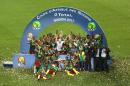 Cameroon's players celebrate with the trophy at the end of the 2017 Africa Cup of Nations final football match between Egypt and Cameroon at the Stade de l'Amitie Sino-Gabonaise in Libreville on February 5, 2017