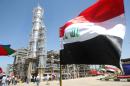 The Iraqi flag flutters at the Al-Dora refinery complex in Baghdad on September 16, 2010