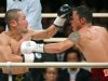 Nobuo Nashiro (left) and Mexican challenger Hugo Cazares trade blows during the WBA super flyweight title match in Osaka