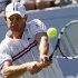 Roddick of the U.S. hits a return to compatriot Williams during their men's singles match at the U.S. Open tennis tournament in New York