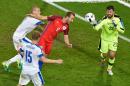 England's forward Harry Kane (C) jumps for the ball in front of Slovakia's goalkeeper Matus Kozacik (R) on June 20, 2016