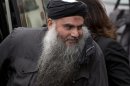 File photograph shows Radical Muslim cleric Abu Qatada, arriving back at his home after being released on bail, in London