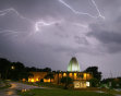 Lightning illuminates the sky above the Pro Football Hall of Fame, Tuesday, June 21, 2011, in Canton, Ohio. (AP Photo/The Canton Repository, Scott Heckel) MANDATORY CREDIT