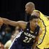 Memphis Grizzlies' Gay drives against Indiana Pacers' West during their NBA basketball game in Indianapolis