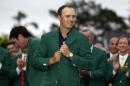 Jordan Spieth wears his green jacket after winning the Masters golf tournament Sunday, April 12, 2015, in Augusta, Ga. (AP Photo/David J. Phillip)