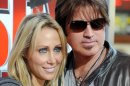 FILE - In this Jan. 9, 2010 file photo, Billy Ray Cyrus, at right, and his wife Laeticia "Tish" Cyrus, arrive to the premiere of "The Spy Next Door" in Los Angeles. Court records show Tish Cyrus filed for divorce on Thursday, June 13, 2013 in Los Angeles Superior Court. (AP Photo/Katy Winn, file)