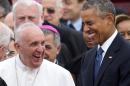 Pope Francis laughs alongside US President Barack Obama upon arrival at Andrews Air Force Base in Maryland, on September 22, 2015, on the start of a 3-day trip to Washington