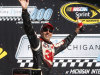 Greg Biffle celebates his victory in the NASCAR Sprint Cup Pure Michigan 400 auto race at Michigan International Speedway Sunday, Aug. 19, 2012, in Brooklyn, Mich. (AP Photo/Bob Brodbeck)