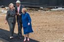 Then US Secretary of State John Kerry (C) talks with former US Secretaries of State Hillary Clinton (L) and Madeleine Albright (R) after breaking ground at the US Diplomacy Center at the US State Department in Washington, DC, September 3, 2014