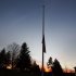 A U.S. flag flies at half staff in front of the Reed Intermediate School in Newtown, Connecticut, following a shooting nearby at Sandy Hook Elementary School