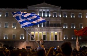 A supporter of the No vote waves a Greek flag in front &hellip;