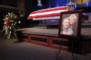 A photograph is displayed at a memorial service for Kaufman County district attorney Mike McLelland and his wife Cynthia in Sunnyvale