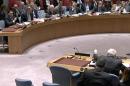 In this image made from a video provided by UNTV, Israel's Ambassador Danny Danon, top left, and Palestinian envoy Riyad Mansour, bottom second from right, speak to one another at an United Nations Security Council meeting Monday, April 18, 2016, at United Nations headquarters. (UNTV via AP) MANDATORY CREDIT