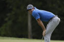 Rory McIlroy, of Northern Ireland, reacts to his missed putt on the sixth hole during the third round of the PGA Championship golf tournament at Valhalla Golf Club on Saturday, Aug. 9, 2014, in Louisville, Ky. (AP Photo/John Locher)