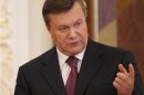 Ukrainian President Yanukovich gestures after a signing ceremony in Kiev