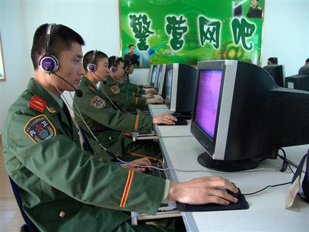 Chinese soldiers surf the Internet at an Internet bar in an army base in Huaibei, in eastern China's Anhui province, April 14, 2005.
