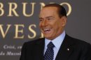 Former Italian Prime Minister Silvio Berlusconi smiles as he arrives to attend the book launch of his friend, TV presenter Bruno Vespa, in Rome