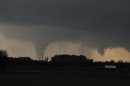 A tornado moves on the ground north of Solomon, Kan., on Saturday evening, April 14, 2012, with I-70 seen in the foreground. (AP Photo/The Hutchinson News, Sandra J. Milburn)