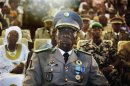 Coup leader Captain Sanogo attends a ceremony as former parliament speaker Traore is sworn in as Mali's interim president in the captial Bamako