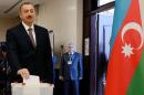 Azeri President Ilham Aliyev casts his ballot at a polling station in Baku during presidential elections on October 9, 2013