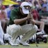 Louis Oosthuizen, of South Africa, reacts after missing a putt during a sudden death playoff on the 10th hole at the Masters golf tournament Sunday, April 8, 2012, in Augusta, Ga. (AP Photo/David J. Phillip)