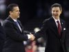 Louisville head coach Rick Pitino, left shakes hands with Kentucky head coach John Calipari before the first half of an NCAA Final Four semifinal college basketball tournament game Saturday, March 31, 2012, in New Orleans. (AP Photo/David J. Phillip)
