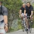 French President Nicolas Sarkozy, flanked by bodyguards as he rides his bicycle near Cavaliere sur Mer, French Riviera, Monday, Aug. 8, 2011.   Sarkozy and his wife, Carla Bruni-Sarkozy, spend their summer holidays at his mother-in-law's property in the Cap Negre. (AP Photo)