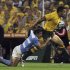 Bosch of Argentina's Los Pumas tackles Tapuai of Australia's Wallabies during their Rugby Championship match in Rosario