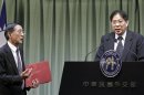 Basilio, Philippines' representative to Taiwan, speaks during a joint news conference as Taiwan Minister of Foreign Affairs Lin gestures to him in Taipei