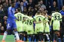 Manchester City players celebrate after scoring during the English FA Cup soccer match between Chelsea and Manchester City at the Stamford Bridge stadium in London, Sunday, Feb. 21, 2016.(AP Photo/Frank Augstein)