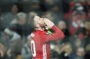 Manchester United's English striker Wayne Rooney celebrates scoring the opening goal against Feyenoord at Old Trafford stadium in Manchester, north-west England, on November 24, 2016