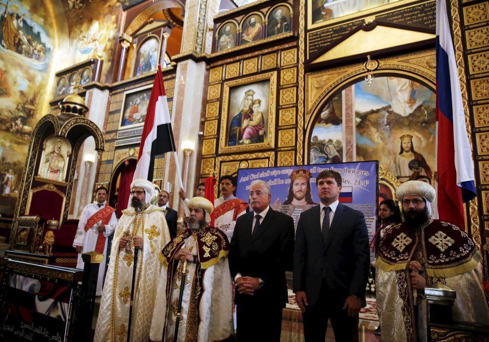South Sinai Governor Khaled Fouda, Coptic Christian priests, and a member of the Russian embassy in Egypt attend a mass mourning the victims and...