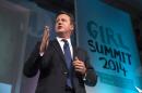 Britain's Prime Minister David Cameron speaks at the 'Girl Summit 2014' at the Walworth Academy in London