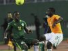 Ivory Coast's Kolo Eboue Emmanuel R fight for the ball with with Senegal s Diame N Doye L during their African nation cup qualifier soccer match in Abidjan September 8, 2012.