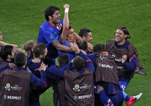 Croatia's Mario Mandzukic, center, celebrates after he scored his team's third goal during the Euro 2012 soccer championship Group C match between the Republic of Ireland and Croatia in Poznan, Poland, Sunday, June 10, 2012. (AP Photo/Anja Niedringhaus)